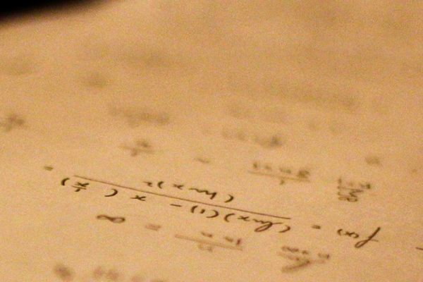 Math formulas written on a piece of paper