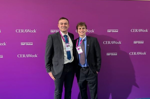 Two students pose for a photo at CERA Week. 