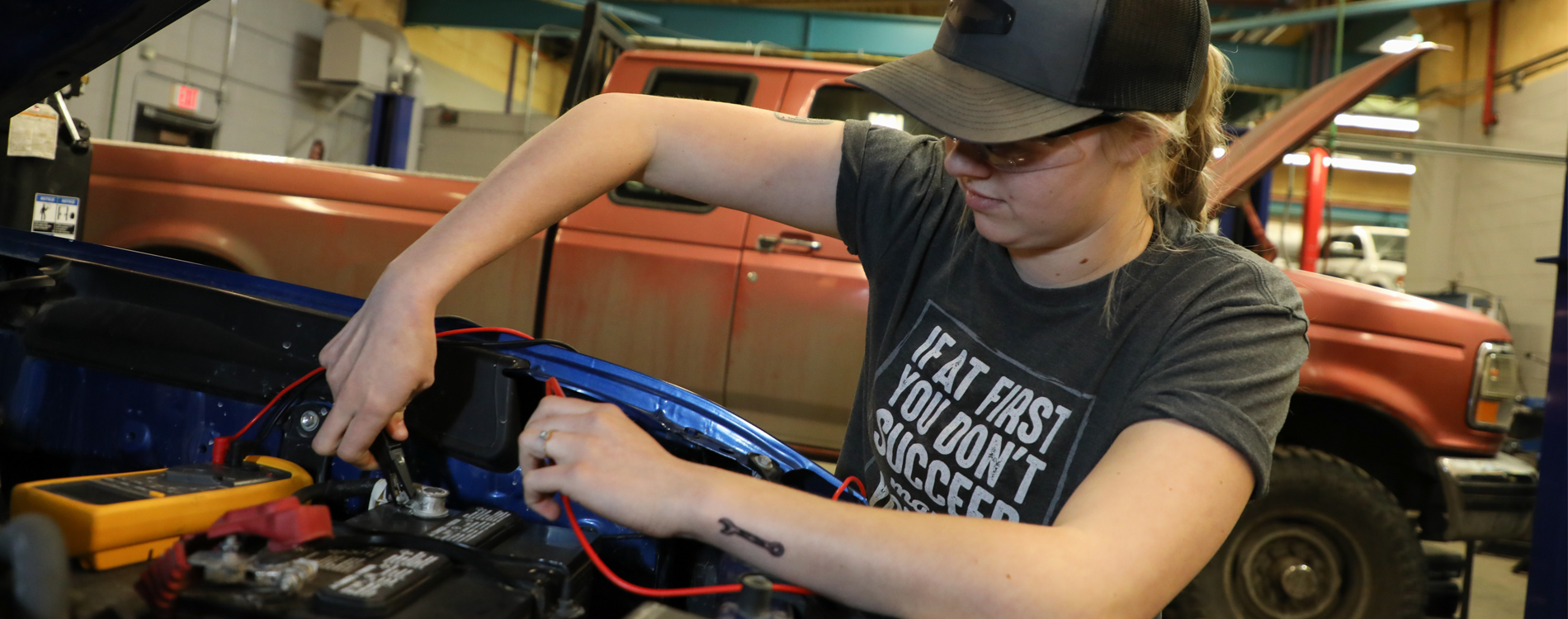 A student works on a car at Highlands College.