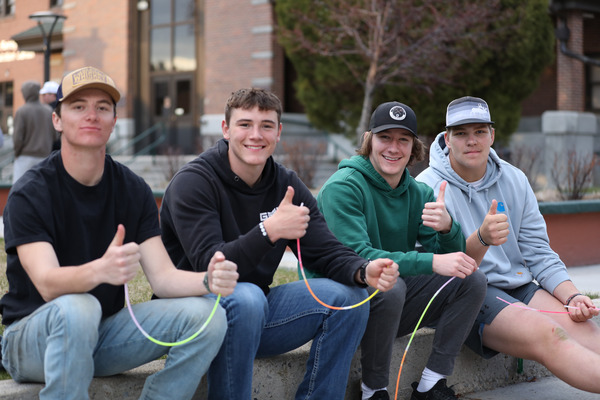 Students giving a thumbs up in the Courtyard.