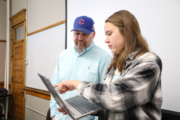 Instructor helping a student