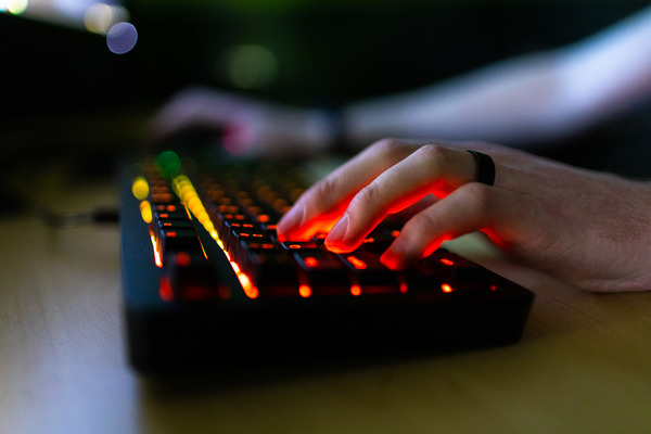 Student typing on keyboard