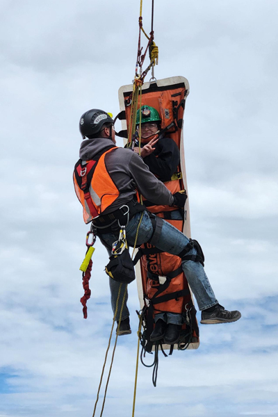 Person being lifted in an air ambulance