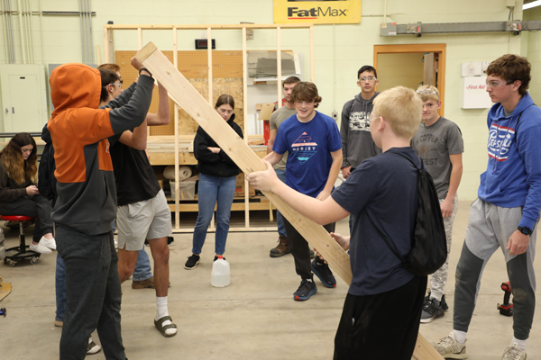 Group of students working on a construction project.