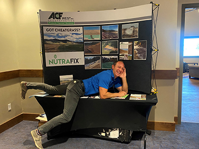 Long-time sponsor Aaron Schmidt of ACF West relaxing at his booth.