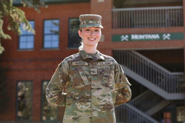 Emma Harper, in her National Guard uniform, poses for a photo on campus.