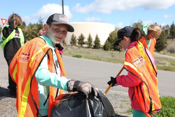 Students pick up trash. 