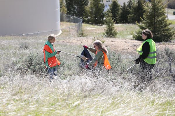 Students pick up trash. 