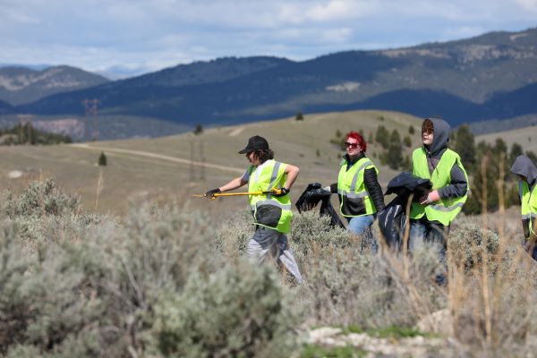 Students pick up trash. 