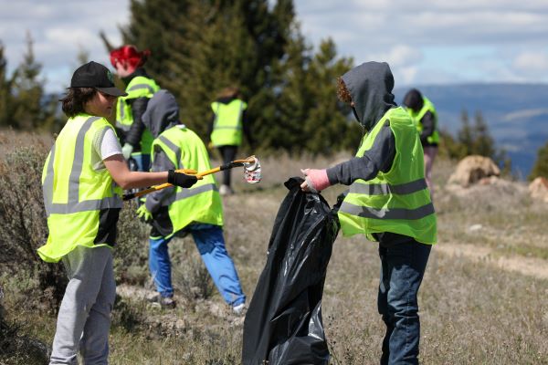 Students pick up trash. 