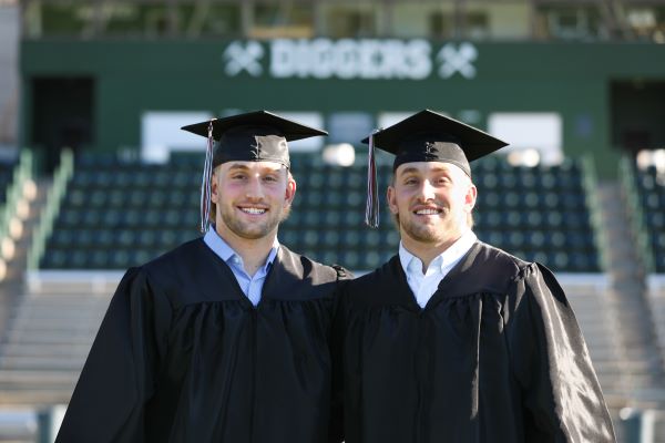 Cade and Cole Wyant in cap and gown