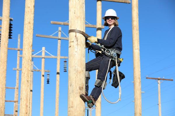 Kaila Roberson climbs powerpole 