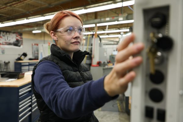 Taylor Warner works on a CNC machine