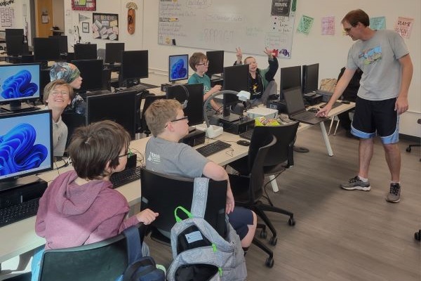 Joel Graff with students in computer lab