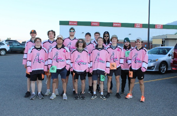 Montana Tech students in pink hockey jerseys. 