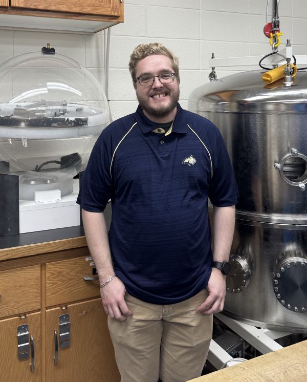 Tyler Holliday in a laboratory setting