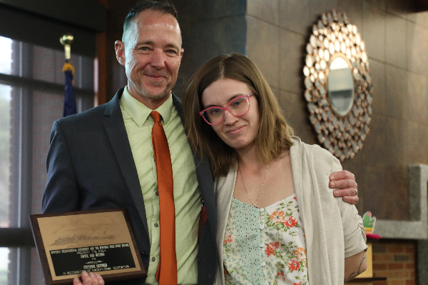 !Chancellor Les Cook presents Cheyenne Crooker with an award