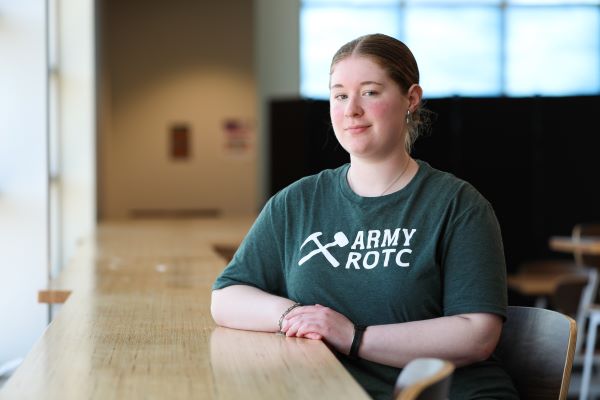 Heather Hood poses for a photo in an ROTC shirt
