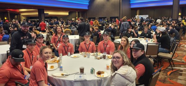 A group of students sit at a table