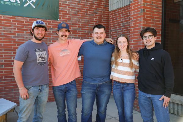 Five Montana tech students pose for a photo