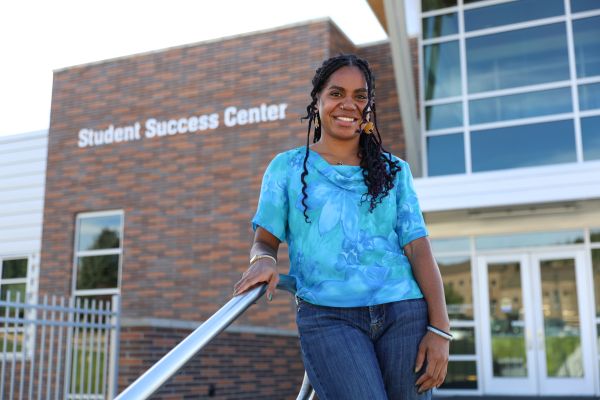 Ola Tipagua in front of the student success center