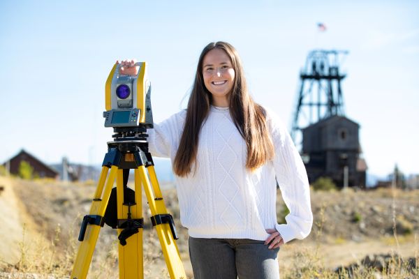 Kenzie with survey equipment
