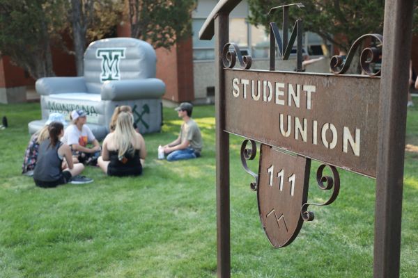 Students lounge outside the student union building