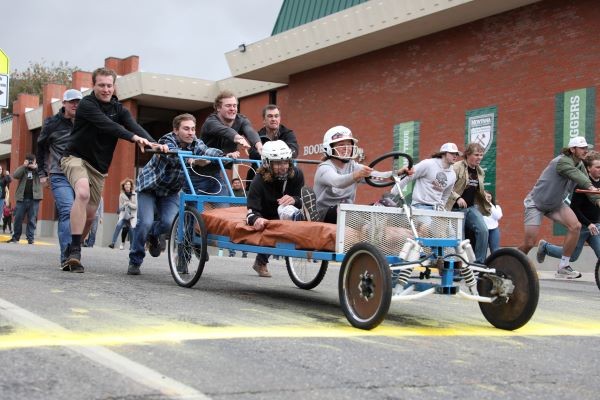 A bed races down park street