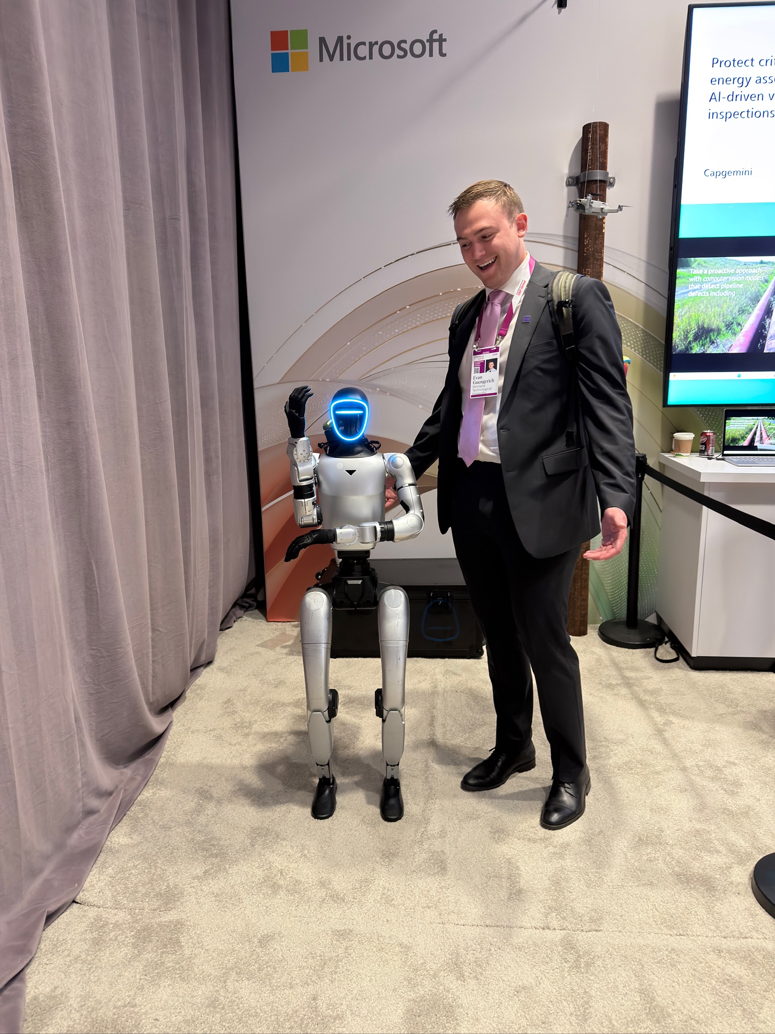 Evan Guengerich with a robot at CERA Week 
