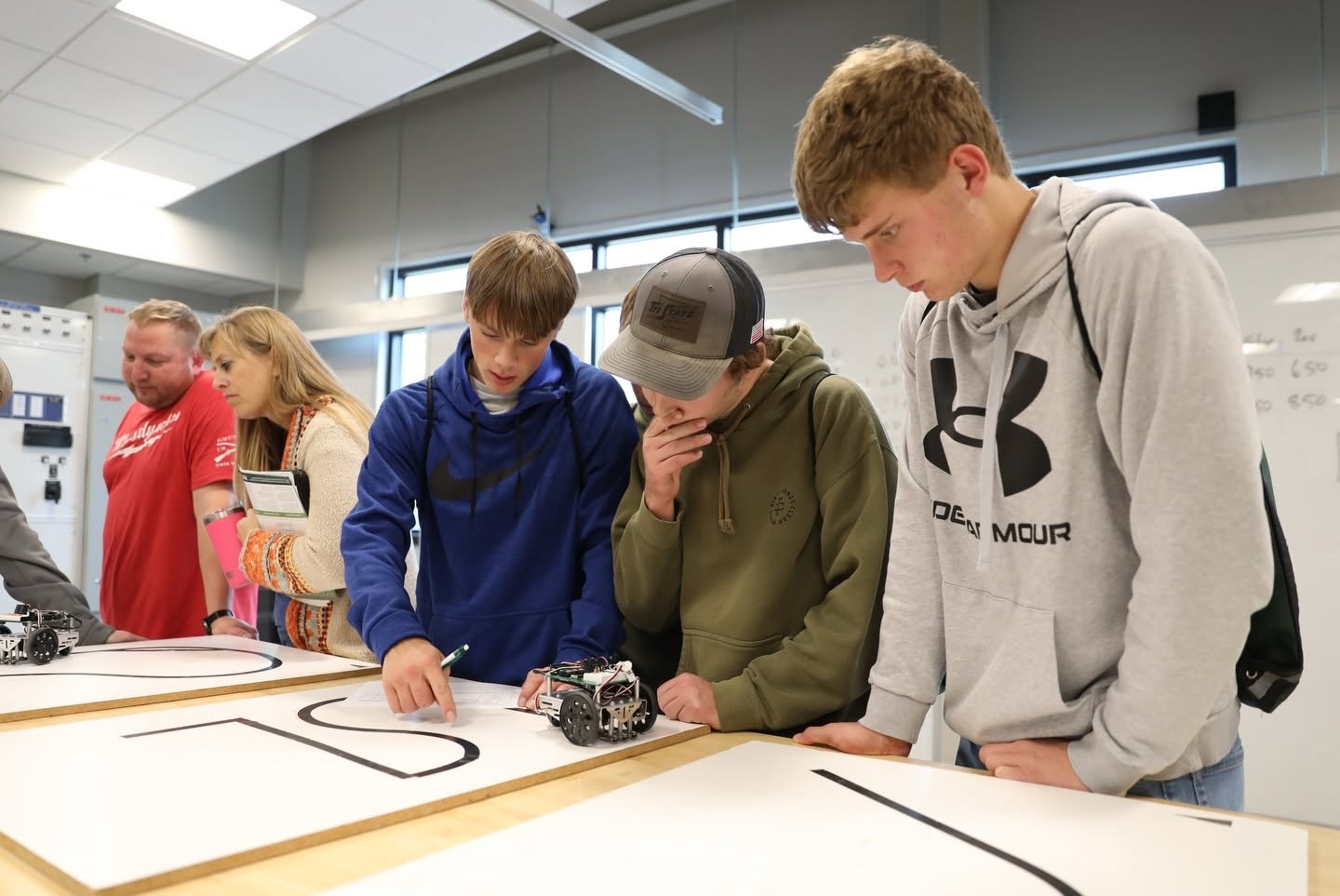 Students work with robotics