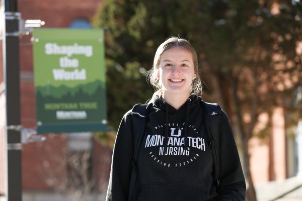 Nacole Sestrich poses for a photo outside on campus