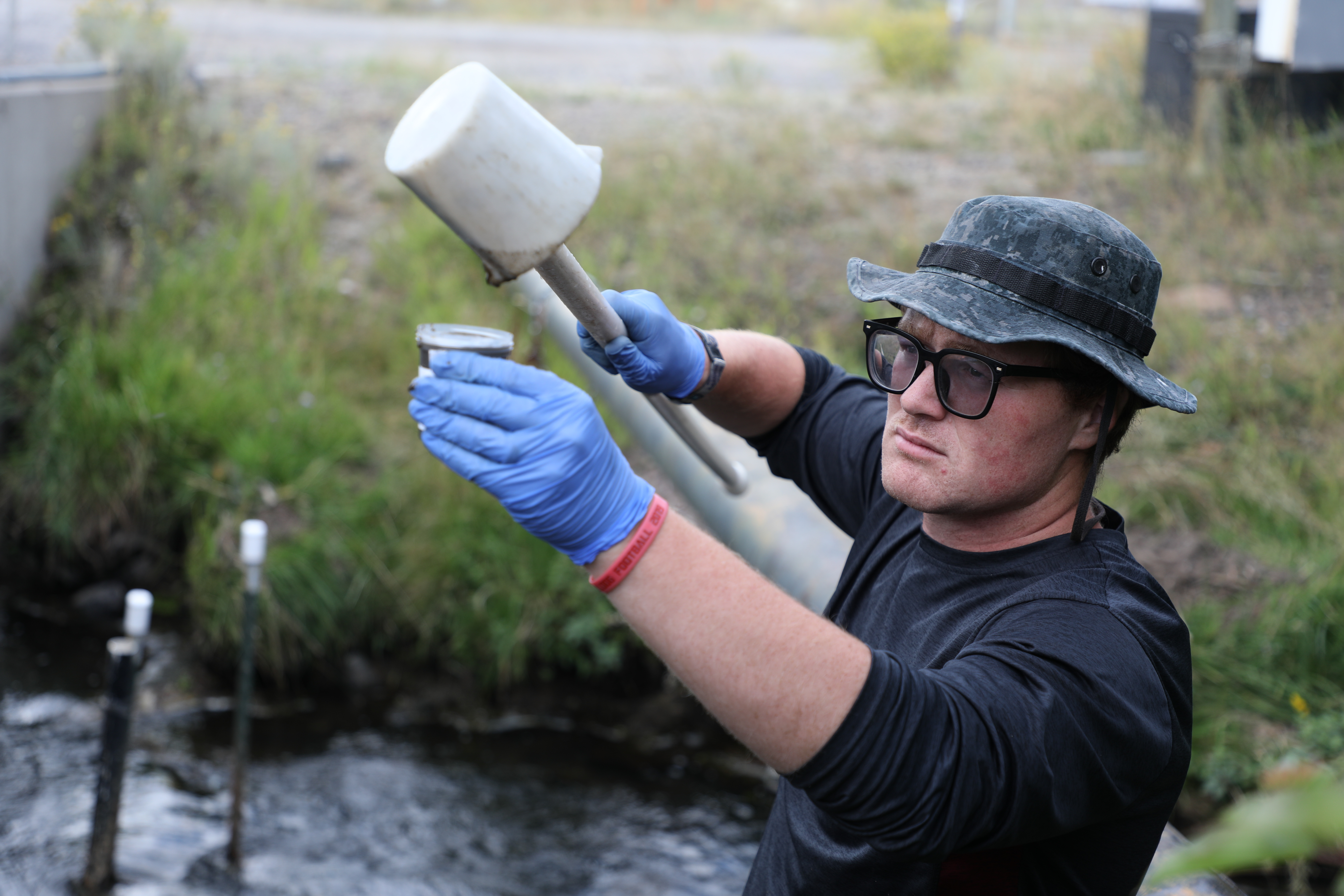 Paul Helfrich works in the creek