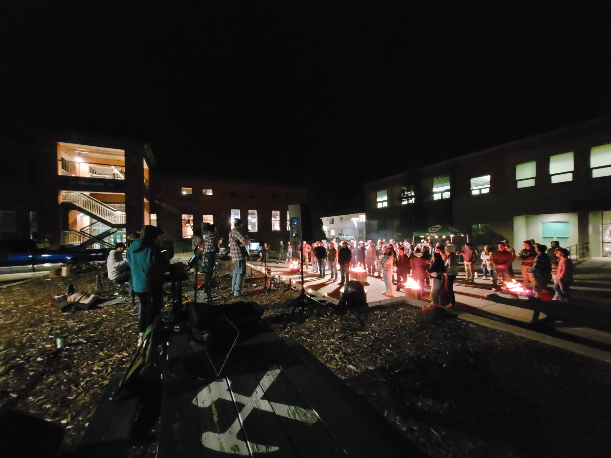 A ChiAlpha event takes place at night on campus