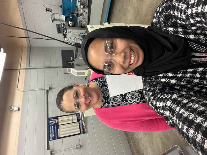 Nusrul Aqilah and Professor Dawn Atkinson pose for a photo in a lab