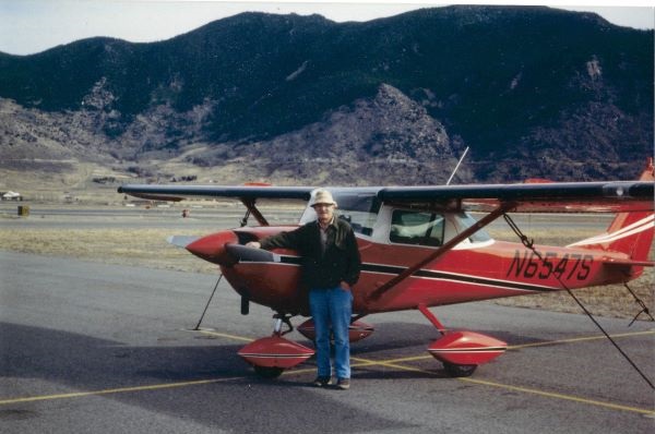 !Professor Hugh Dresser stands in front of a plane