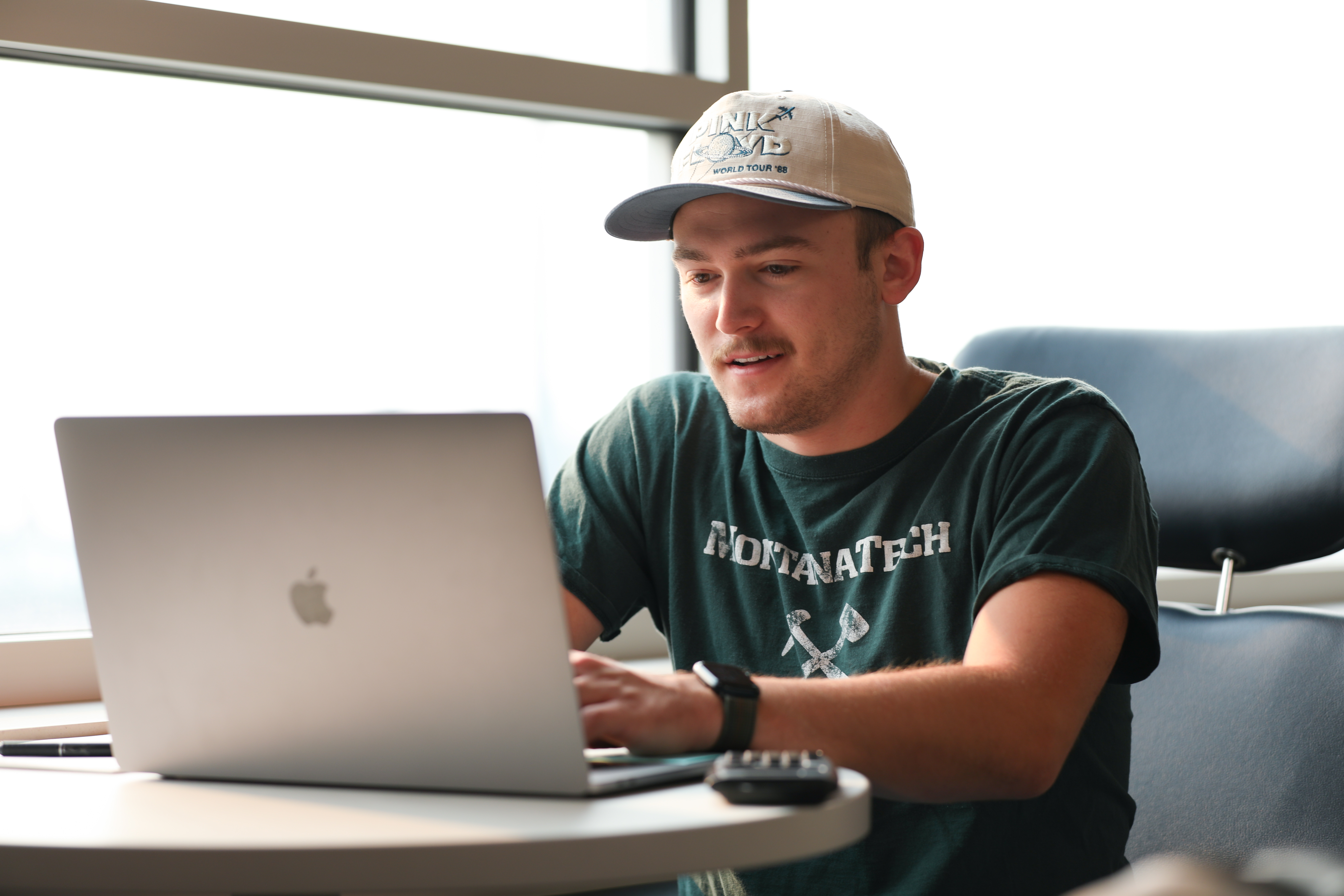 Evan Guengerich  works on a laptop